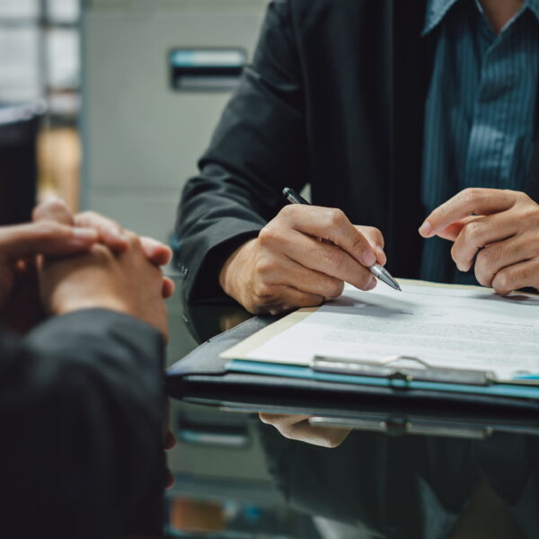 Person reviewing bail bond agreement with bail agent before signing Vista bail bonds contract