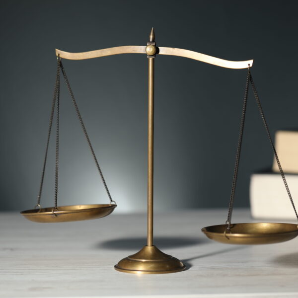 Scales of justice representing the legal process during the Santee bail bonds approval process and defendant release.