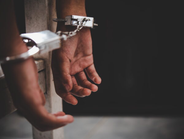 Man in handcuffs following an arrest in Santee, California